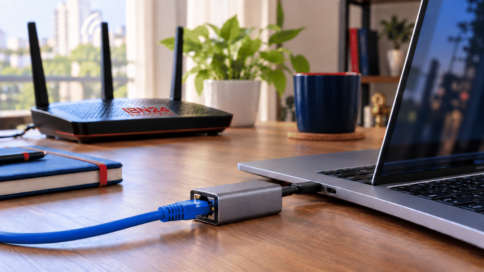 Laptop connected by Ethernet with a Wi-Fi router in the background
